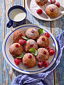 Bomboloni with raspberries and raspberry jam