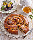 Roll (coiled) cake with plums