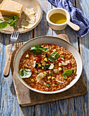 Italian creamy risotto with tomatoes and zucchini