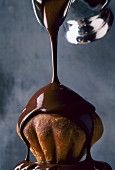 Melted chocolate pouring over brioche