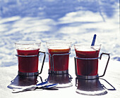 Mugs of mulled wine with cinnamon