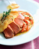 Fillet of lamb with thyme-baked tomatoes and courgettes