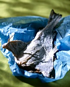 Salted fish in blue paper