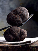 Black truffles with fork