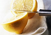 sliced lemon with knife
