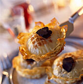 Mini Pastilla parcels filled with pigeon and topped with truffles
