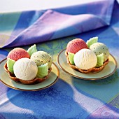 scoops of ice cream in tulip wafer cases