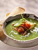 Cream of pea soup with crisp diced bacon