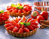 Individual strawberry tarts with raspberry cream