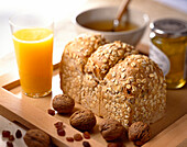 wholewheat bread, walnuts, raisins, cereal and orange juice