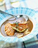Fish soup with fillets of mullet