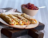 Rolled pancakes with chicken, sweet corn and pepper filling