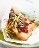 Trout with capers cooked in wax paper