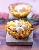 Potato nests filled with soft-boiled quail eggs