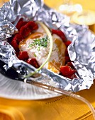 Bass and preserved tomatoes cooked in aluminium foil