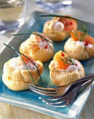 Pastry puffs stuffed with cream and salmon