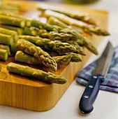 Asparagus on chopping board