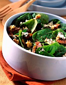 A salad with baby spinach leaves and Roquefort cheese