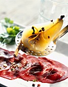 Beef carpaccio and spiced pear