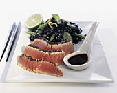 Tuna with sesame seeds and cuttlefish ink pasta