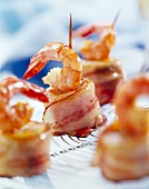 Banana pieces wrapped in bacon with spicy prawns