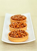 Individual nut and toffee tarts