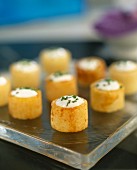 potato cylinders stuffed with cream and chives