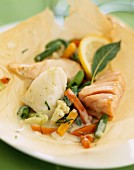 Fish and vegetables with parsley papillote