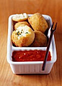 Rice croquettes and tomato sauce