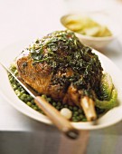 Leg of lamb with herbs, peas and lettuce