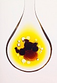 Spoonful of oil and drops of balsamic vinegar