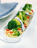 Chinese noodles with anchovies and vegetable salad