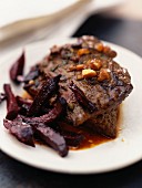 Beef steak with beetroot chips