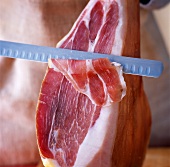 Cutting raw ham