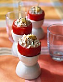 Tomatoes in egg cups stuffed with crab
