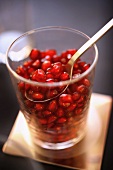 Glass of pomegranate seeds