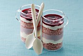 Small glass cups of pink dessert trifle-style