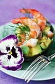 Avocado with prawns and pansies