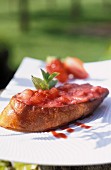 Grilled bread topped with strawberry jam