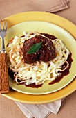 Rabbit braised in red wine with tagliatelle