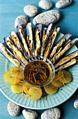 Razor clams with orange and cinnamon sauce and potato salad