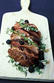 Roast beef with bacon,thyme in flower and blackberries