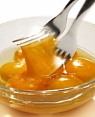Beating egg yolks in a bowl