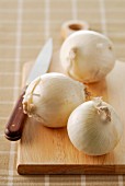 White onions on a chopping board