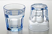 Glass of water and empty glass