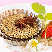 Fennel seeds and star anise in tartlet mould