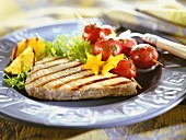 Grilled chicken escalope with cherry tomato skewers