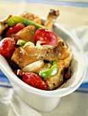Chicken legs with tomatoes and peppers