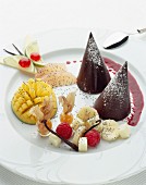 Dark chocolate cones with exotic fruit and vanilla pods