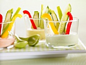 Raw vegetables with a selection of yoghurt dips